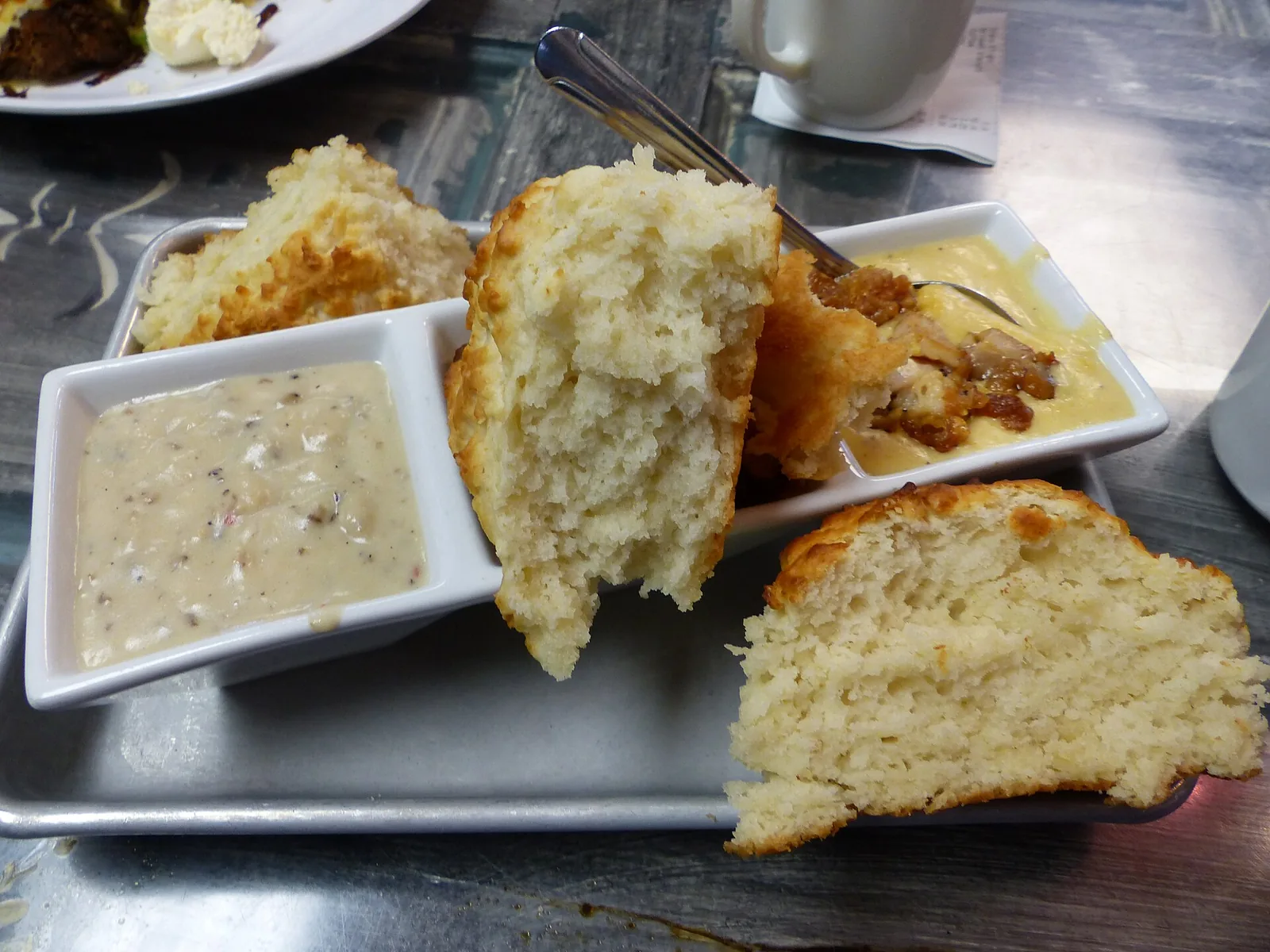 Biscuits with gravy, served as a flight, at Biscuit Head in Asheville.