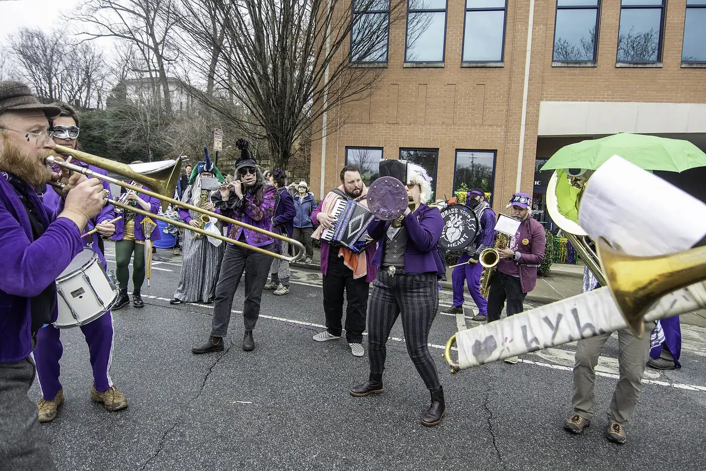 A brass band parades on Coxe Avenue in the South Slope, the street at the center of Asheville's Independence Day Block Party.