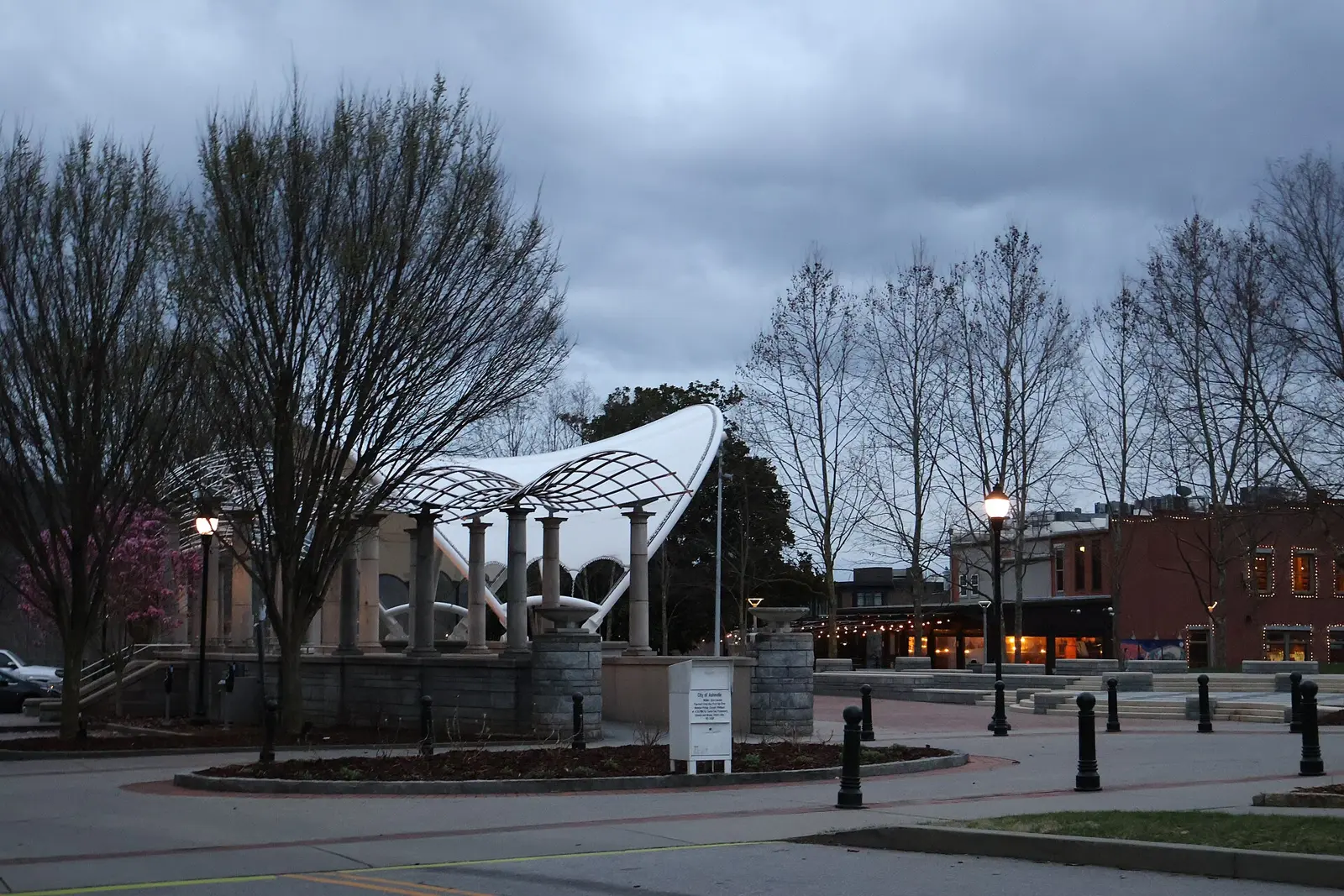 The covered stage at Pack Square Park in downtown Asheville at dusk.
