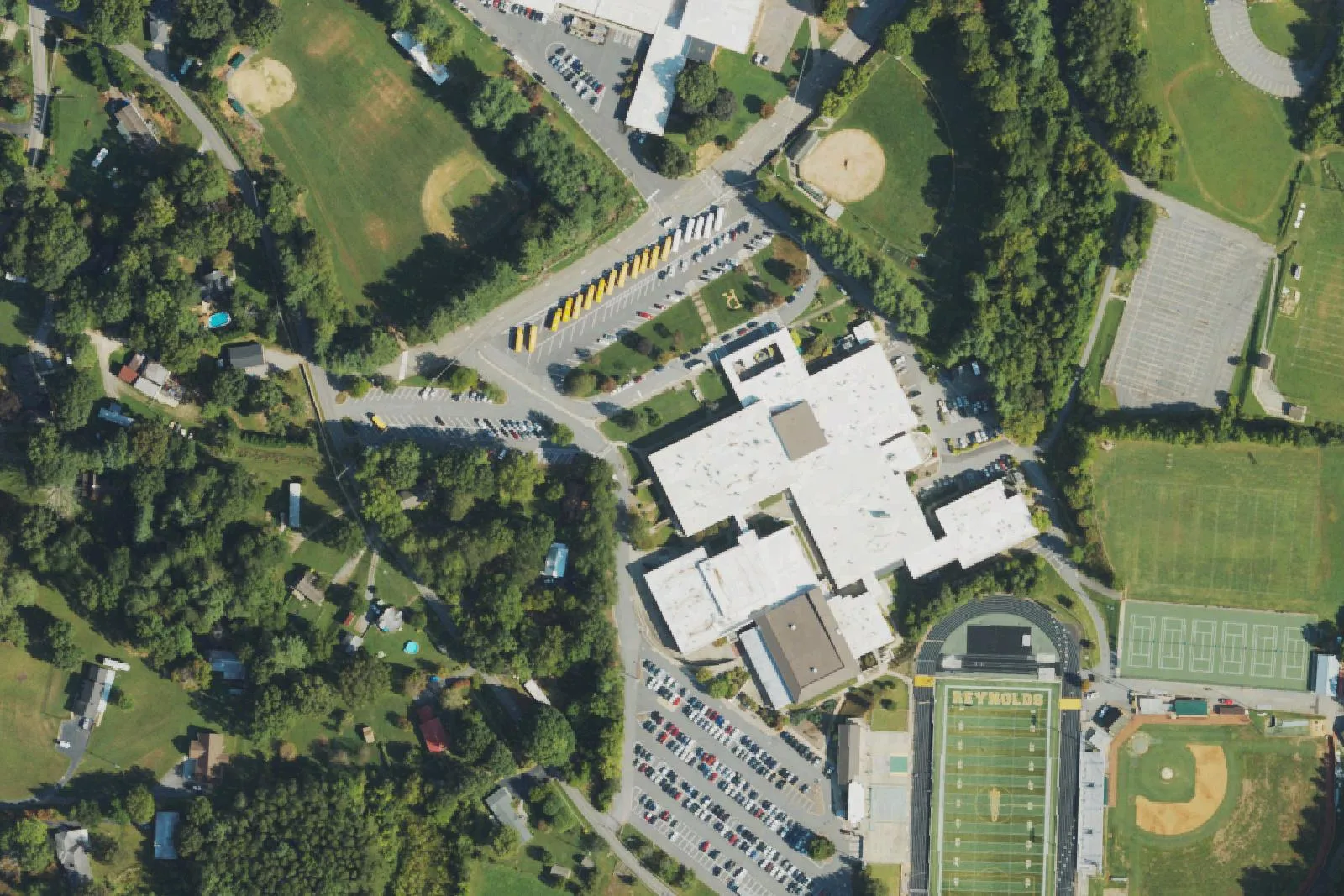 A.C. Reynolds High School's buildings, stadium and ball fields off Rocket Drive, seen from the air