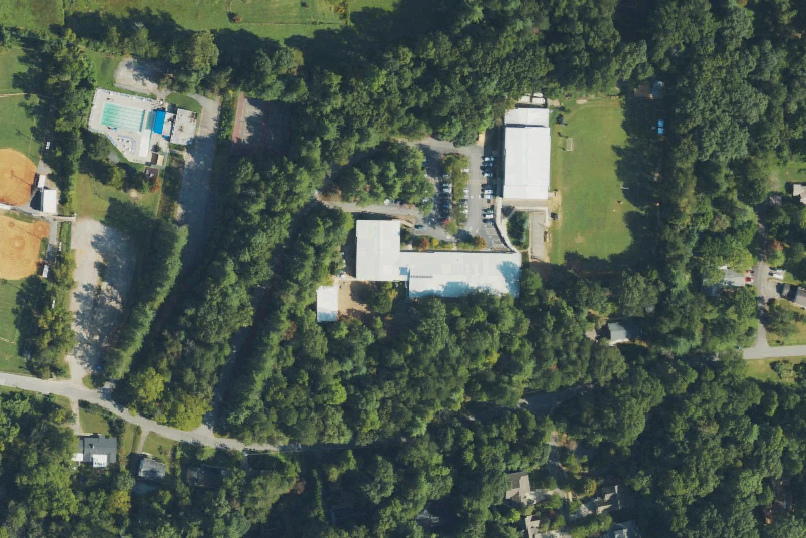 Evergreen Community Charter School's wooded campus on Bell Road in east Asheville, seen from the air